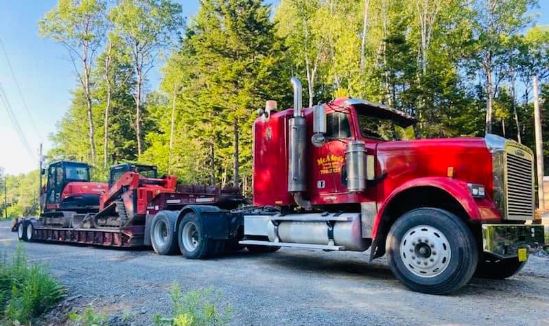 McAdoo's flatbed trucking services with mini excavator and skid steer