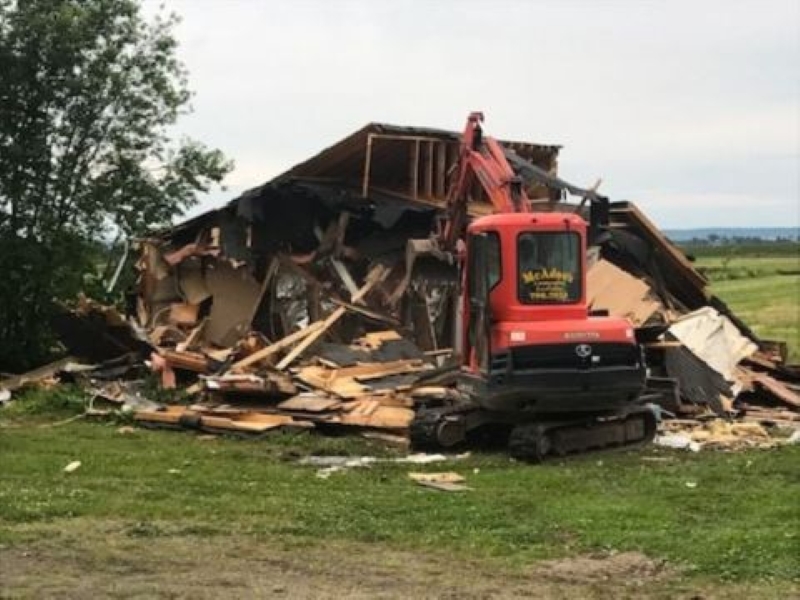 McAdoo's demolition of building with small excavator